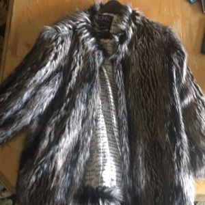 Faux fur black and cream hip length.